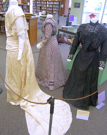 Close-up of three dresses.