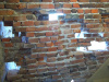 Gift shop wall after deteriorated bricks removed.